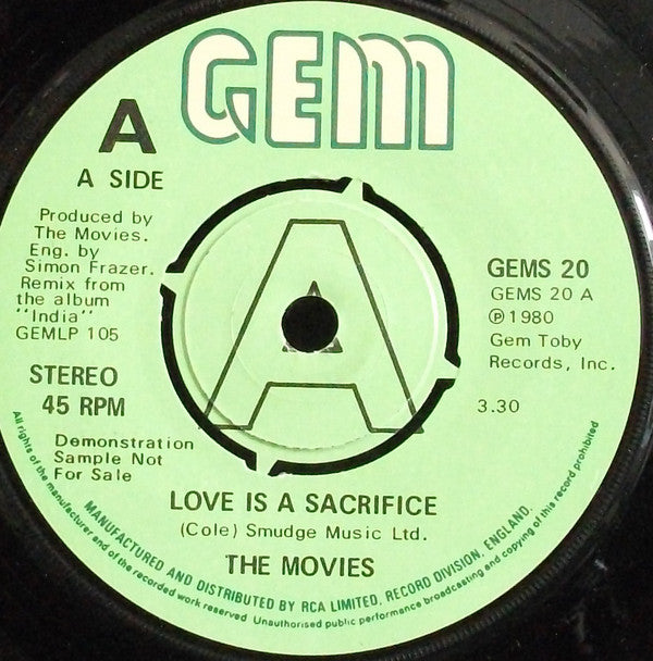 Movies - Love Is A Sacrifice - Used Vinyl Record 7"